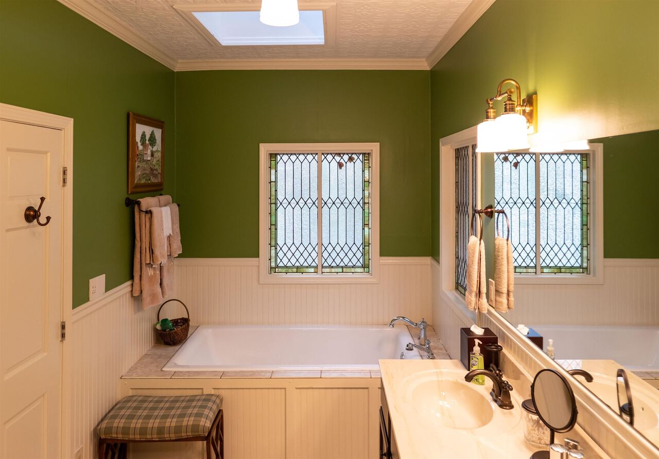 183 Madden Road Bowdon, GA 30108 - Photo 30 of 79 a bathroom with a sink and a mirror