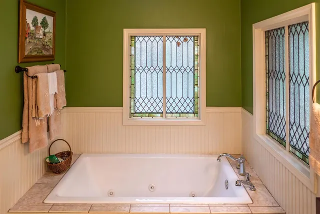 a bedroom with furniture and a window