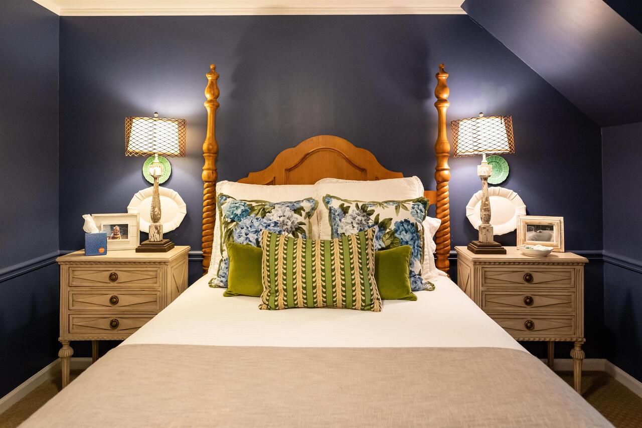 183 Madden Road Bowdon, GA 30108 - Photo 36 of 79 a bedroom with a bed and a lamp on dresser