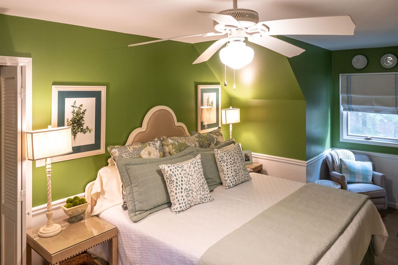 183 Madden Road Bowdon, GA 30108 - Photo 42 of 79 a bedroom with a bed and a chandelier