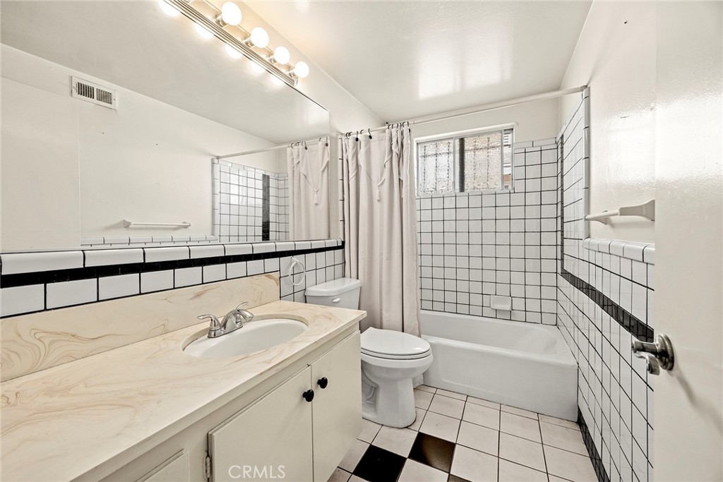 19409 Belshaw Avenue Carson, CA 90746 - Photo 13 of 15 a bathroom with a sink toilet and shower