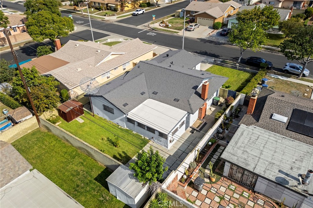 19409 Belshaw Avenue Carson, CA 90746 - Photo 3 of 15 an aerial view of a house with a swimming pool and outdoor space