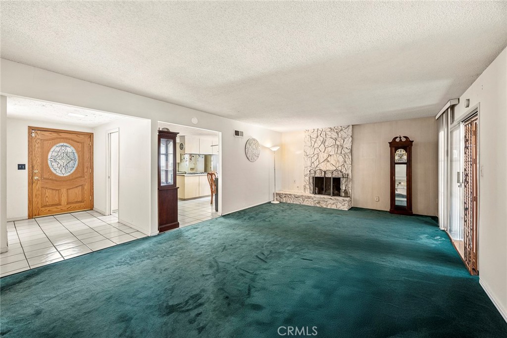 19409 Belshaw Avenue Carson, CA 90746 - Photo 5 of 15 a view of a livingroom with a fireplace