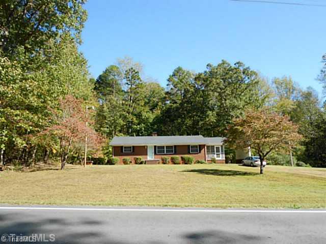 329 Bescher Chapel Road Trinity, NC 27370 - Photo 2 of 16 Landscaping. Large front yard keeps the home off of the road.