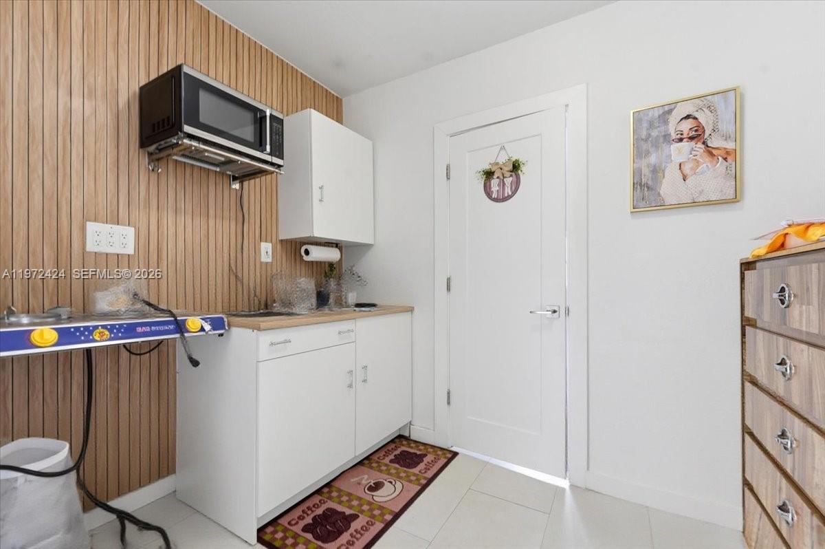 511 East 27th Street Hialeah, FL 33013 - Photo 17 of 24 a kitchen with stainless steel appliances a refrigerator and a stove top oven