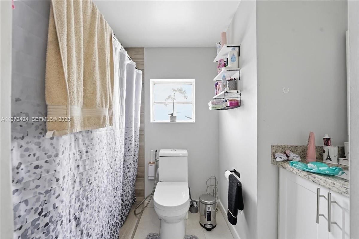 511 East 27th Street Hialeah, FL 33013 - Photo 18 of 24 a bathroom with a toilet and a sink