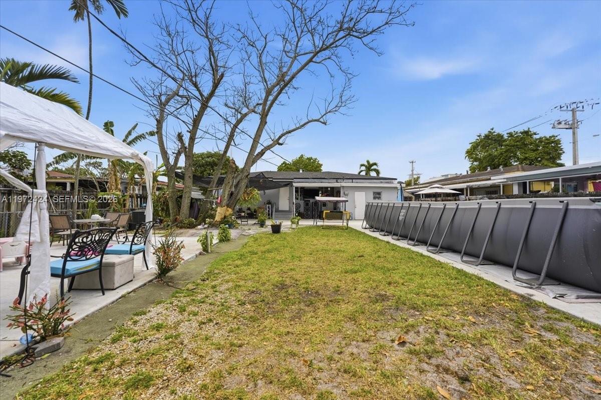 511 East 27th Street Hialeah, FL 33013 - Photo 20 of 24 a view of a backyard with sitting area