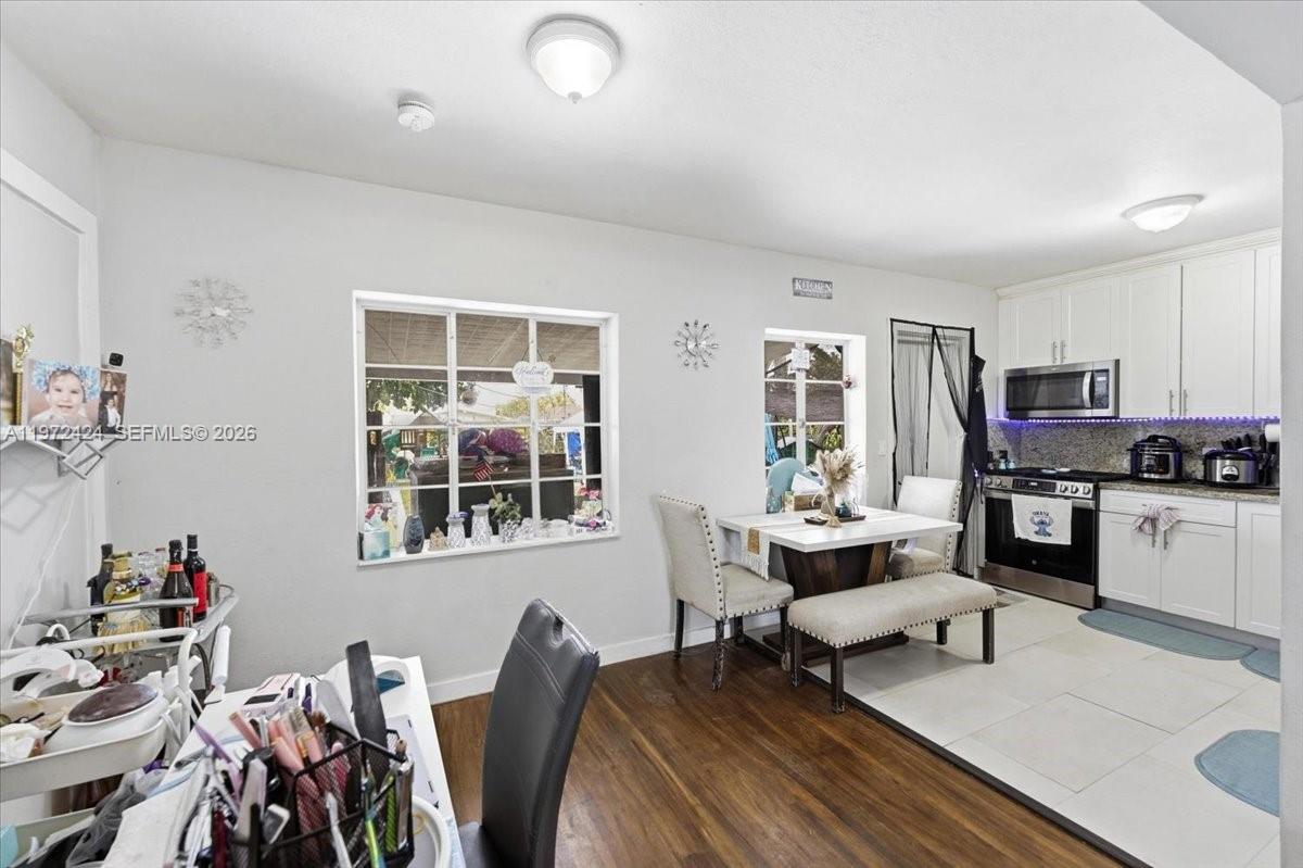 511 East 27th Street Hialeah, FL 33013 - Photo 7 of 24 a living room with furniture and a window