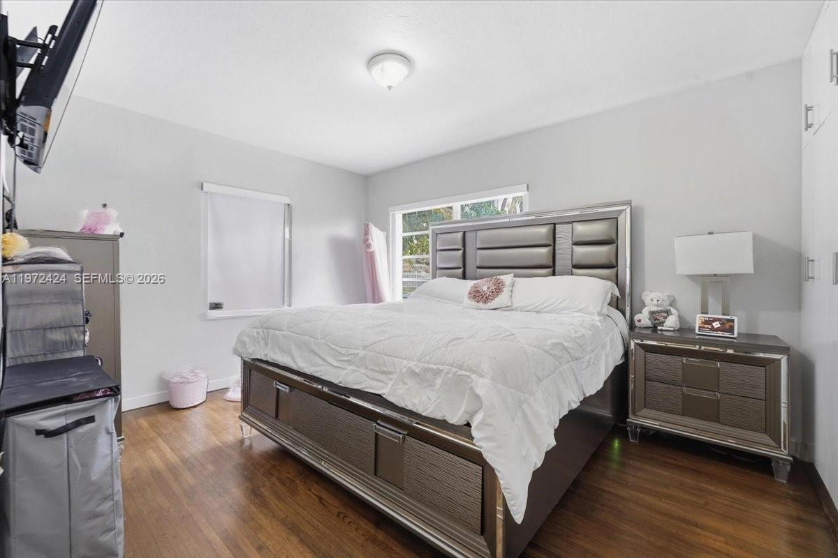 511 East 27th Street Hialeah, FL 33013 - Photo 10 of 24 a bed room with a bed and a television