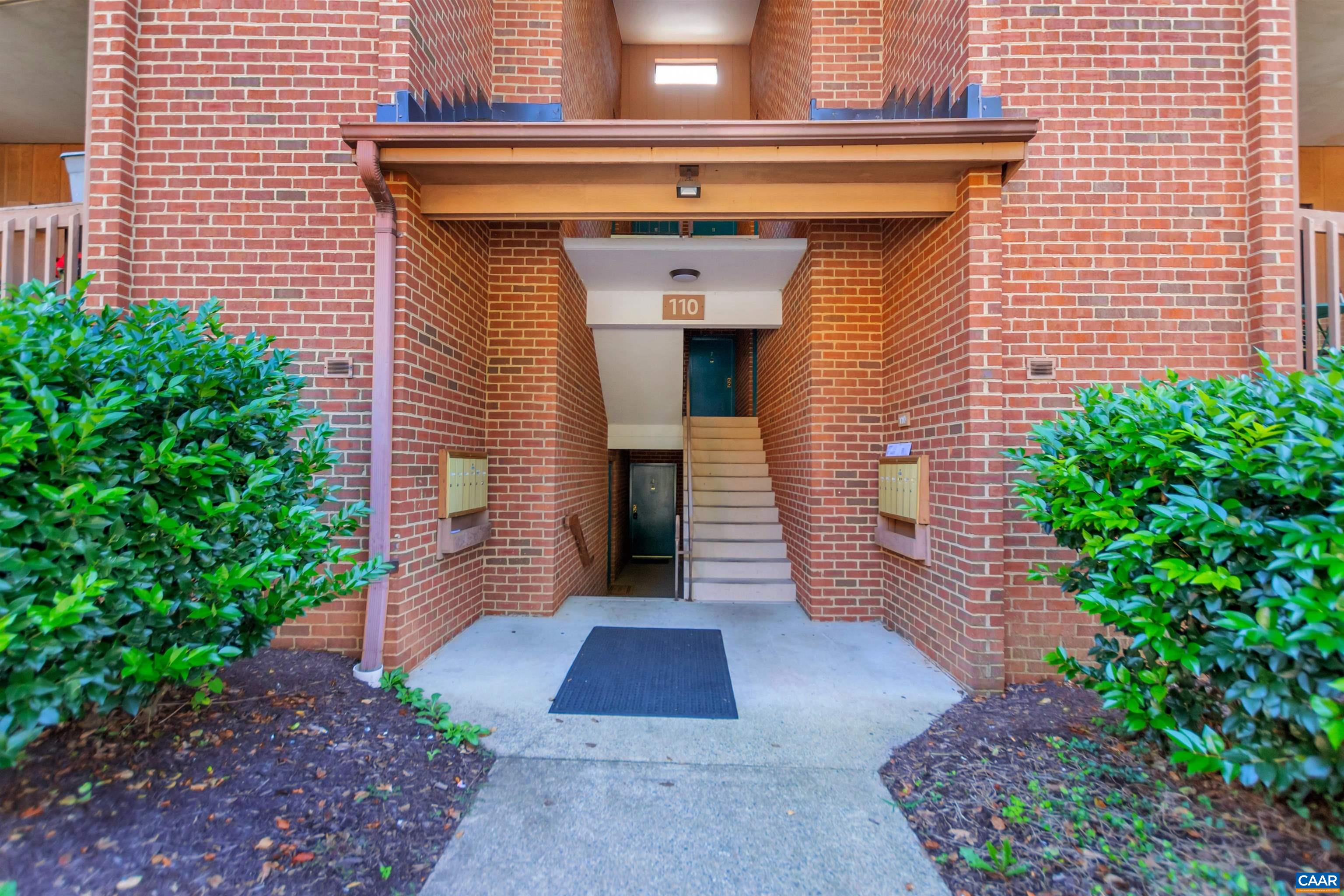 110 Turtle Creek Road Charlottesville, VA 22901 - Photo 1 of 44 a view of entryway with flower plants