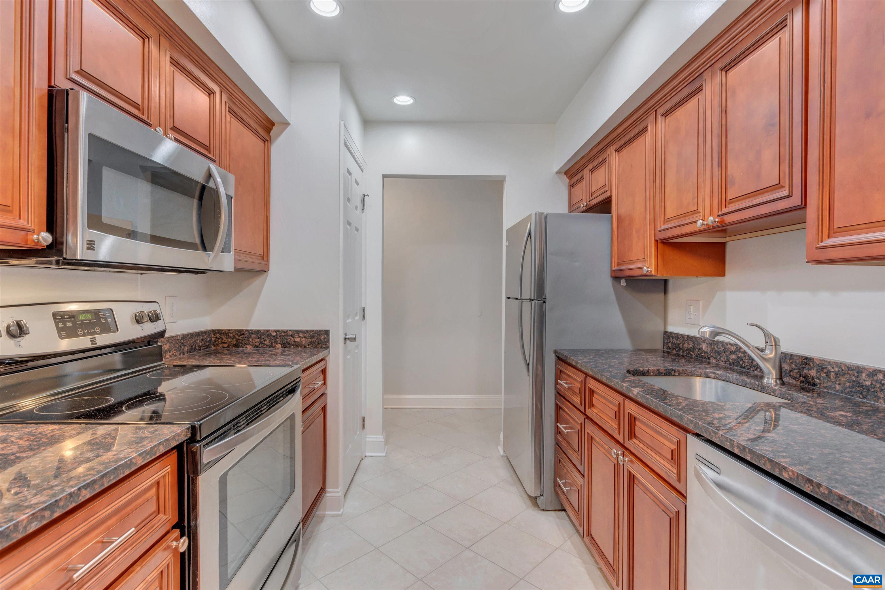 110 Turtle Creek Road Charlottesville, VA 22901 - Photo 11 of 44 a kitchen with stainless steel appliances granite countertop a sink stove and refrigerator