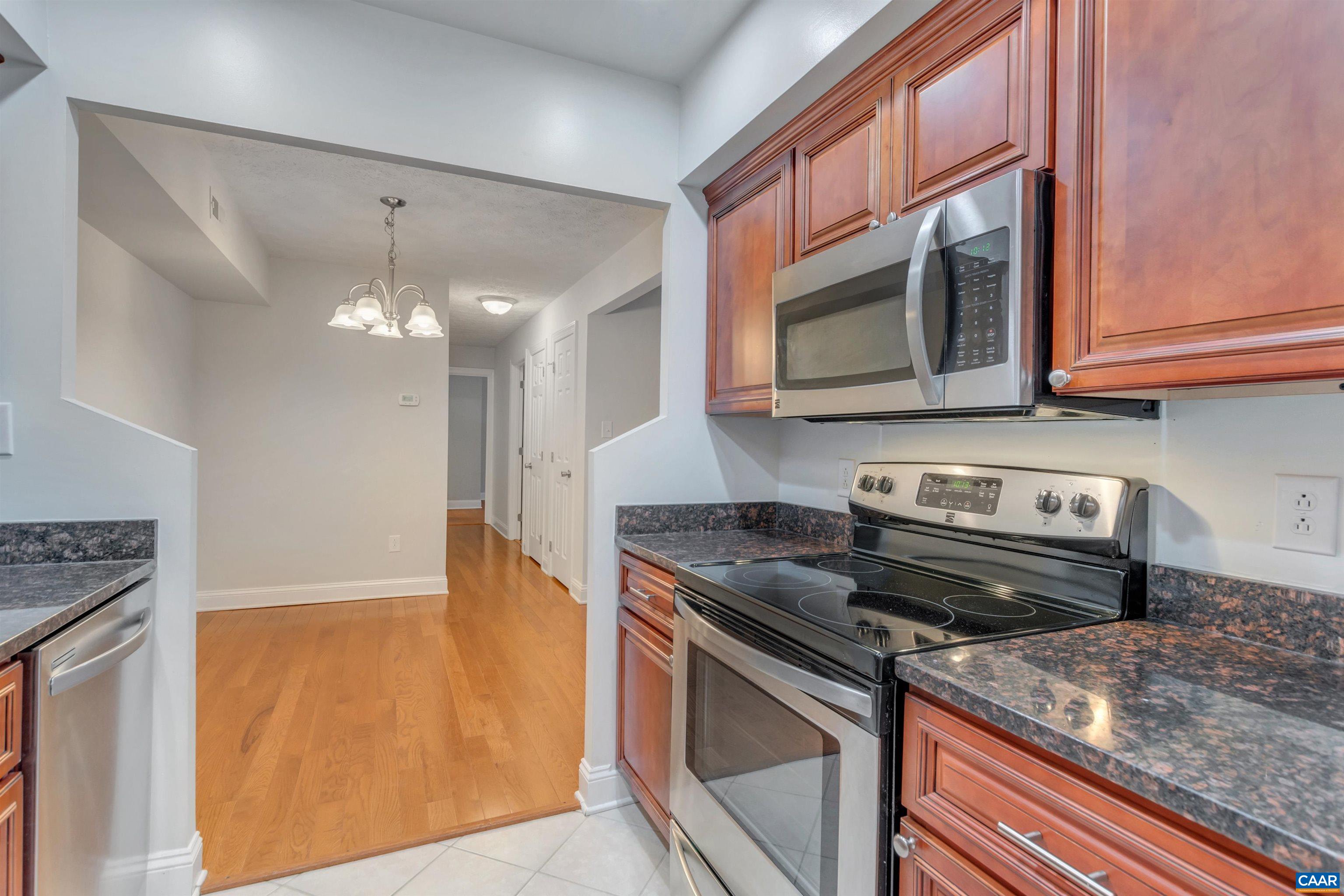 110 Turtle Creek Road Charlottesville, VA 22901 - Photo 10 of 44 a kitchen with stainless steel appliances granite countertop a stove and a microwave