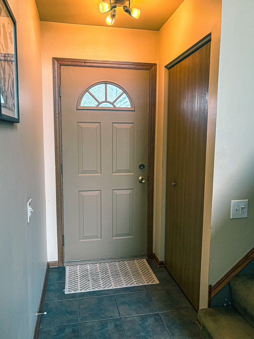 1567 Spaulding Road, Unit 1567 Bartlett, IL 60103 - Photo 2 of 13 a view of front door with a door