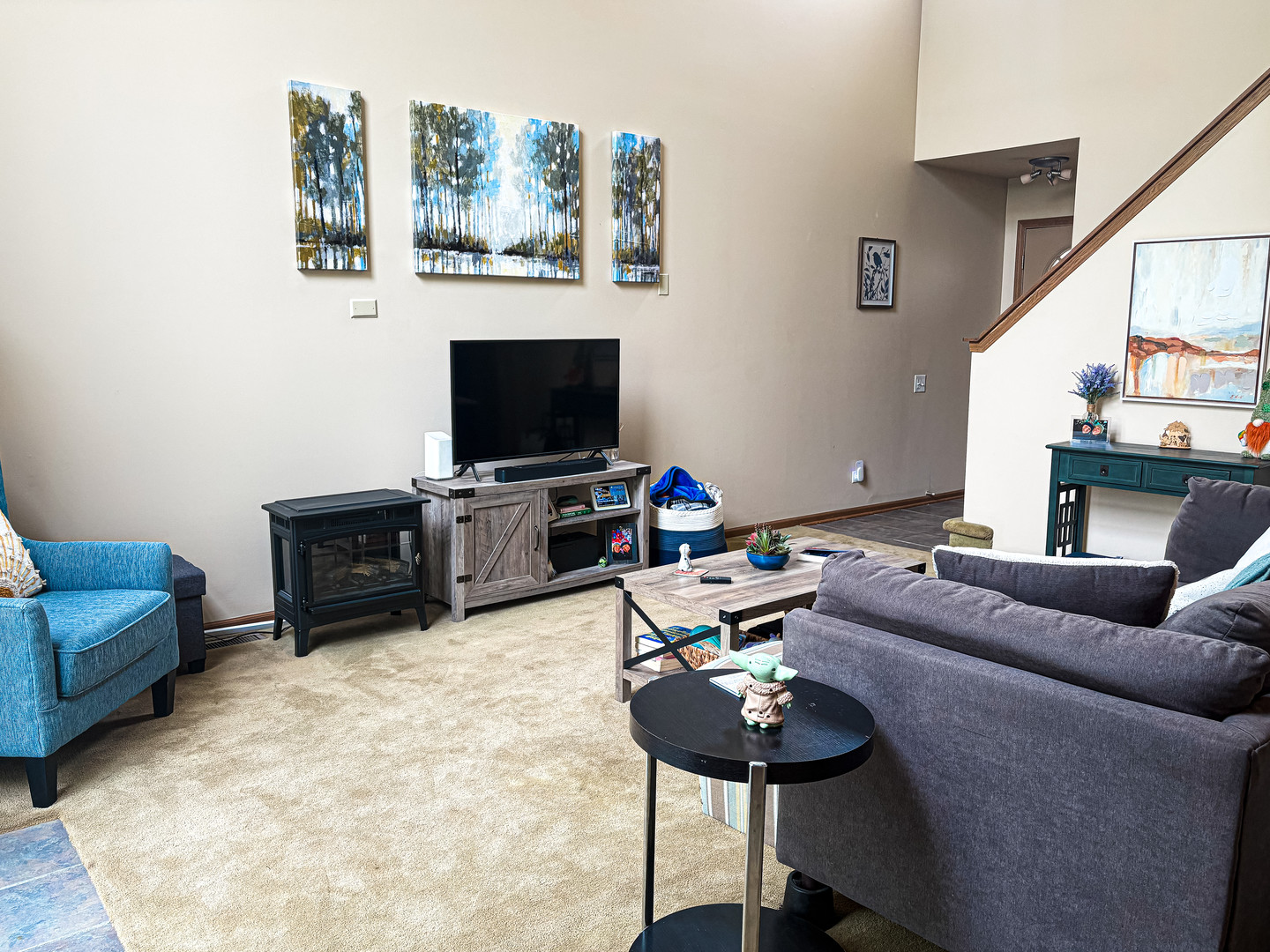 1567 Spaulding Road, Unit 1567 Bartlett, IL 60103 - Photo 3 of 13 a living room with furniture and a flat screen tv