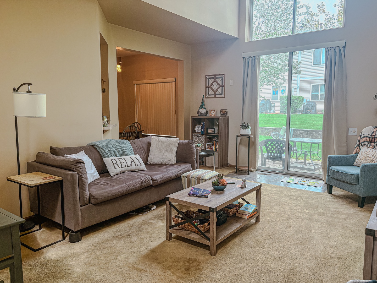 1567 Spaulding Road, Unit 1567 Bartlett, IL 60103 - Photo 4 of 13 a living room with furniture and a large window
