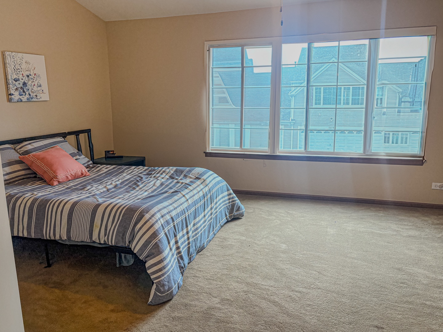 1567 Spaulding Road, Unit 1567 Bartlett, IL 60103 - Photo 10 of 13 a bed sitting in a bedroom next to a window