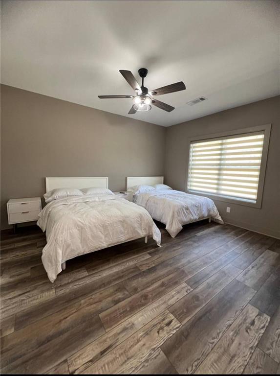950 Island Shoals Road Jackson, GA 30233 - Photo 12 of 23 a bedroom with two beds and a ceiling fan
