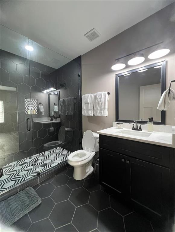 950 Island Shoals Road Jackson, GA 30233 - Photo 15 of 23 a bathroom with a sink toilet and a mirror
