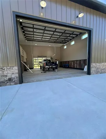 a view of a garage with cars