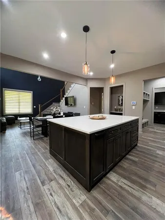 a kitchen with a sink and cabinets