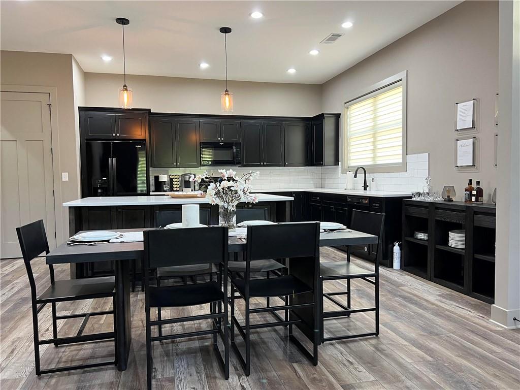 950 Island Shoals Road Jackson, GA 30233 - Photo 4 of 23 a kitchen with a table and chairs in it