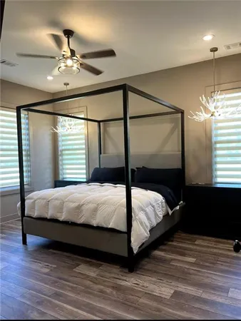 a bedroom with a bed and window