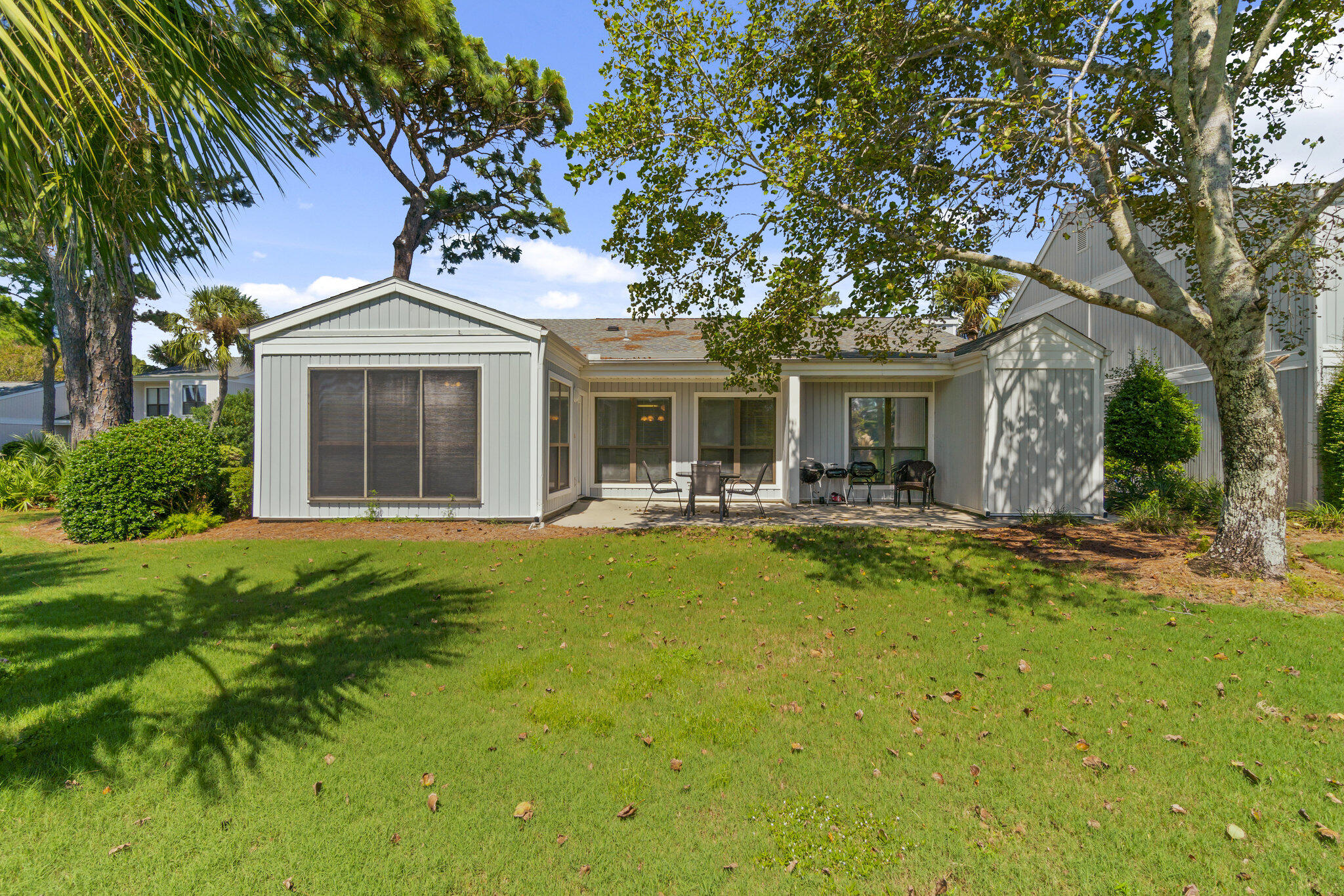 a front view of a house with a yard table and chairs