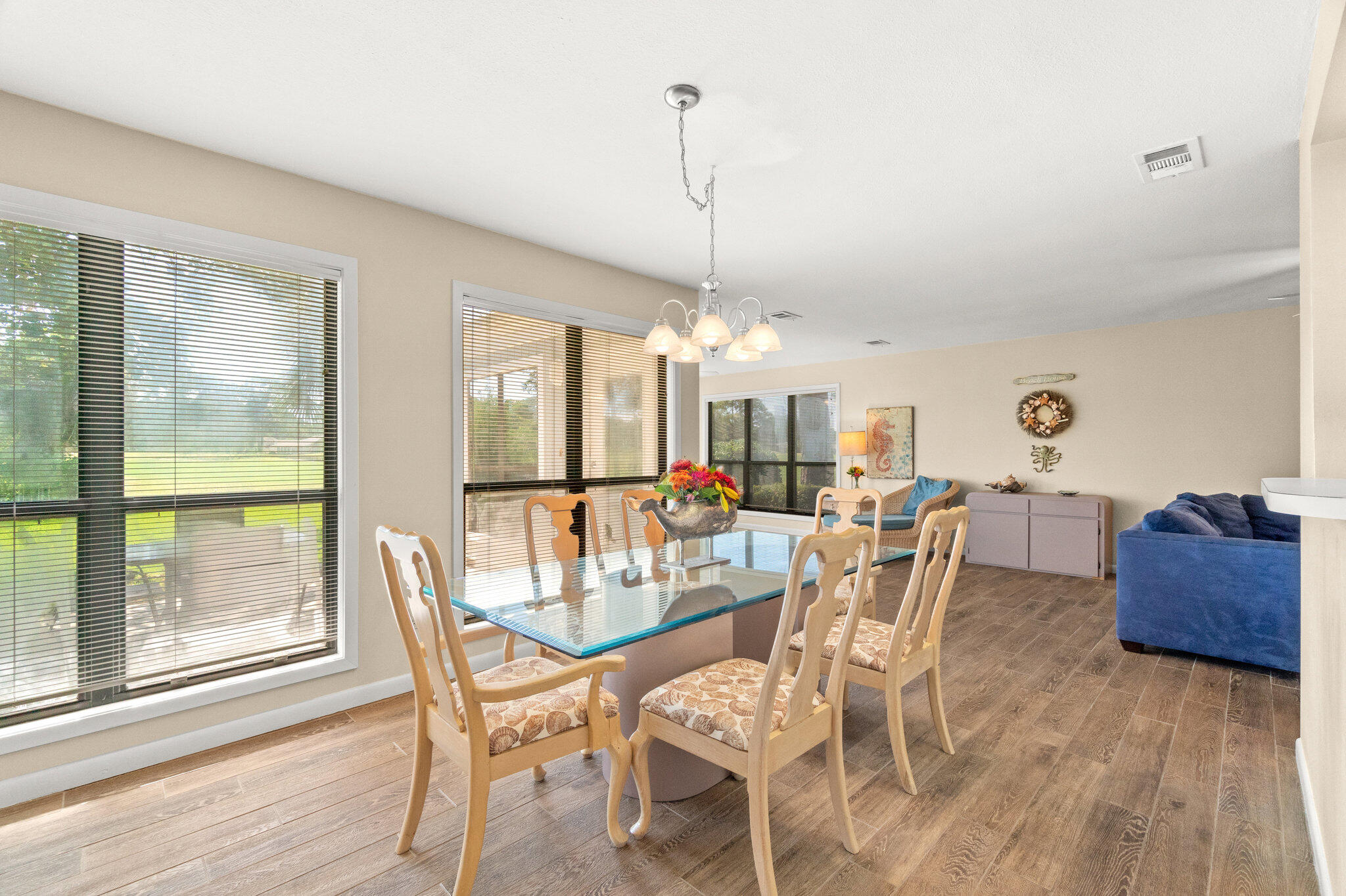 752 Sandpiper Drive, Unit 10535 Miramar Beach, FL 32550 - Photo 11 of 32 a view of a dining room with furniture window and wooden floor