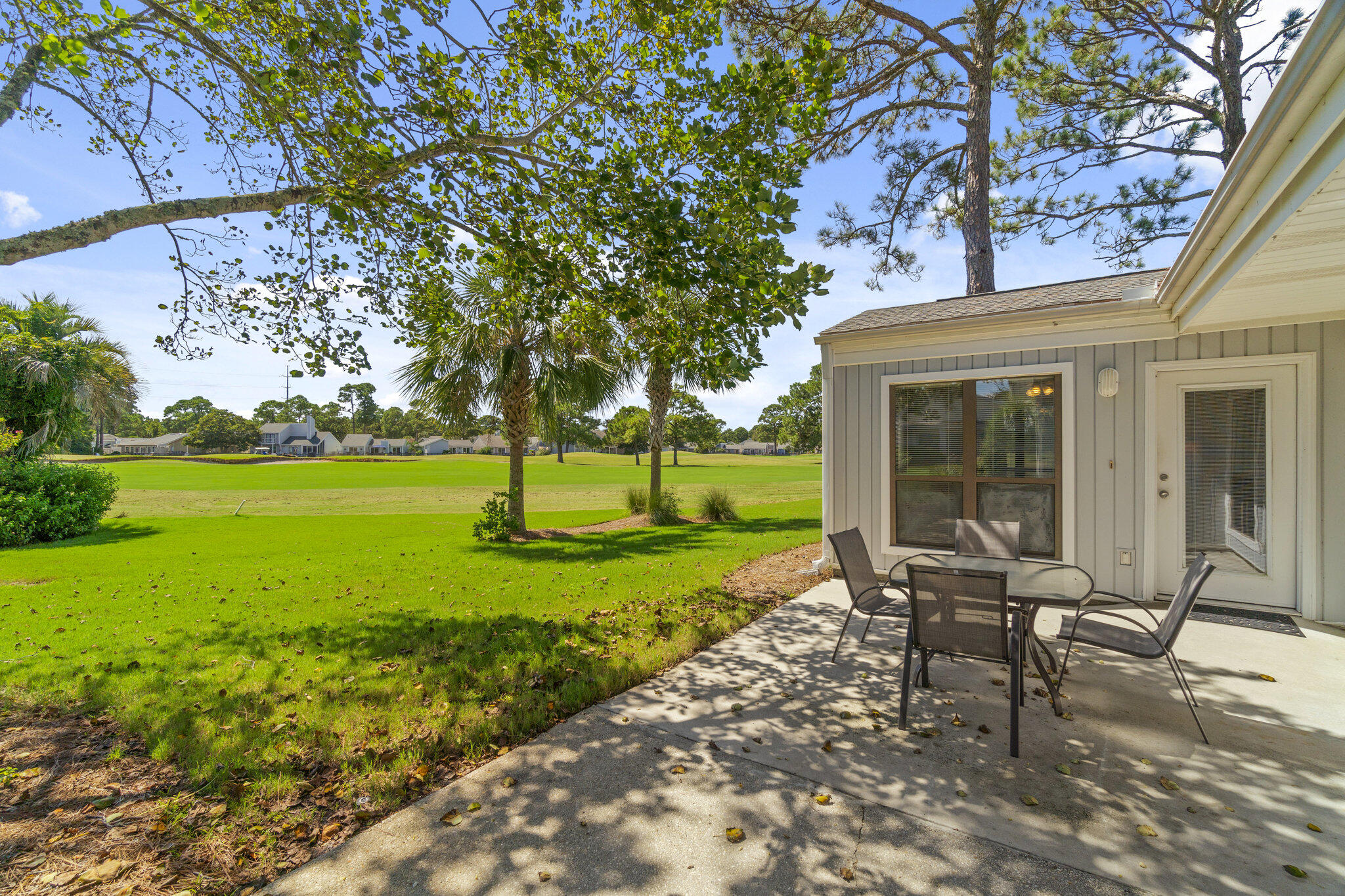 752 Sandpiper Drive, Unit 10535 Miramar Beach, FL 32550 - Photo 17 of 32 a view of a house with backyard sitting area and garden