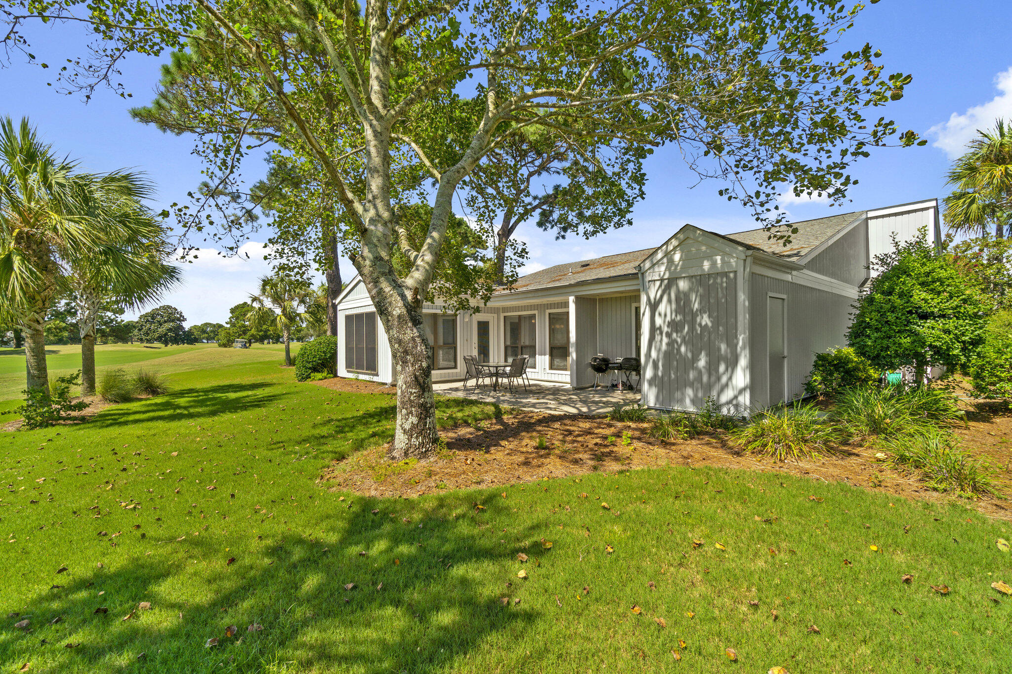 752 Sandpiper Drive, Unit 10535 Miramar Beach, FL 32550 - Photo 18 of 32 a view of a house with backyard and sitting area