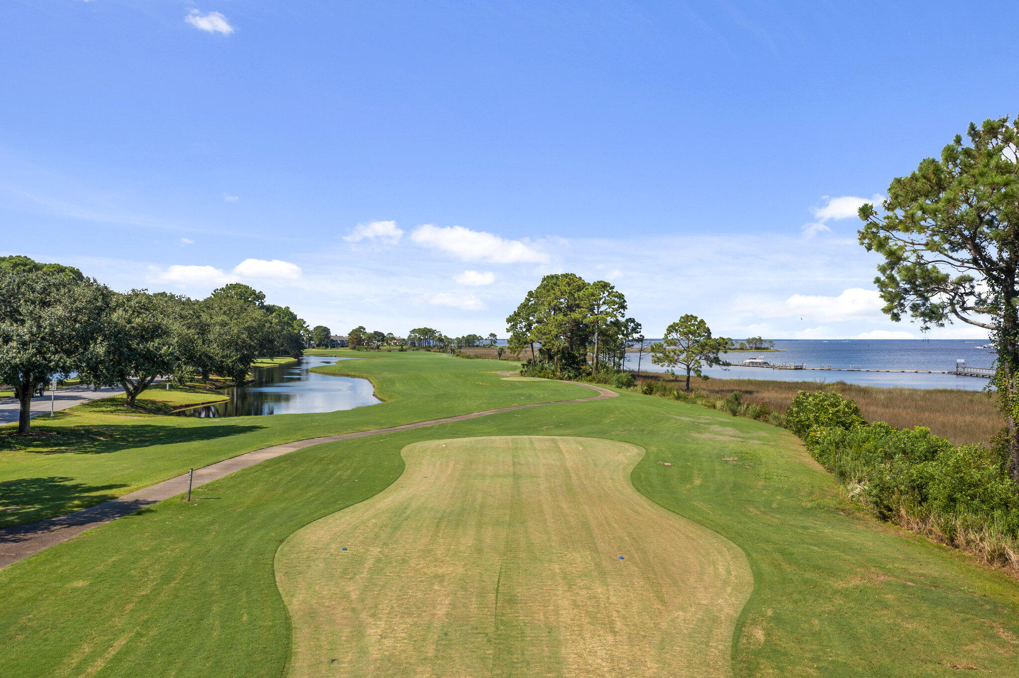 752 Sandpiper Drive, Unit 10535 Miramar Beach, FL 32550 - Photo 24 of 32 a view of a golf course with a lake