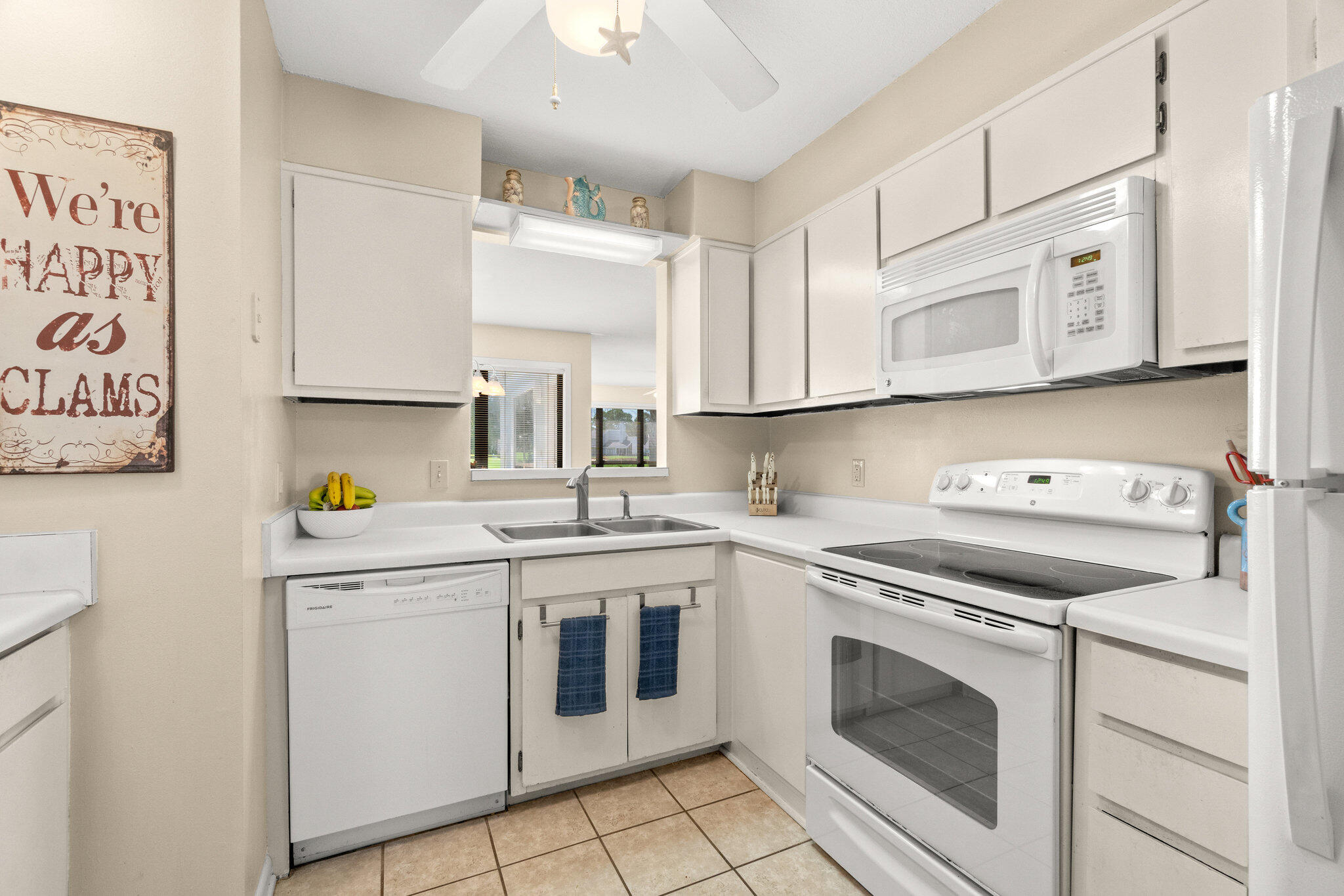 752 Sandpiper Drive, Unit 10535 Miramar Beach, FL 32550 - Photo 4 of 32 a kitchen with cabinets appliances and a sink