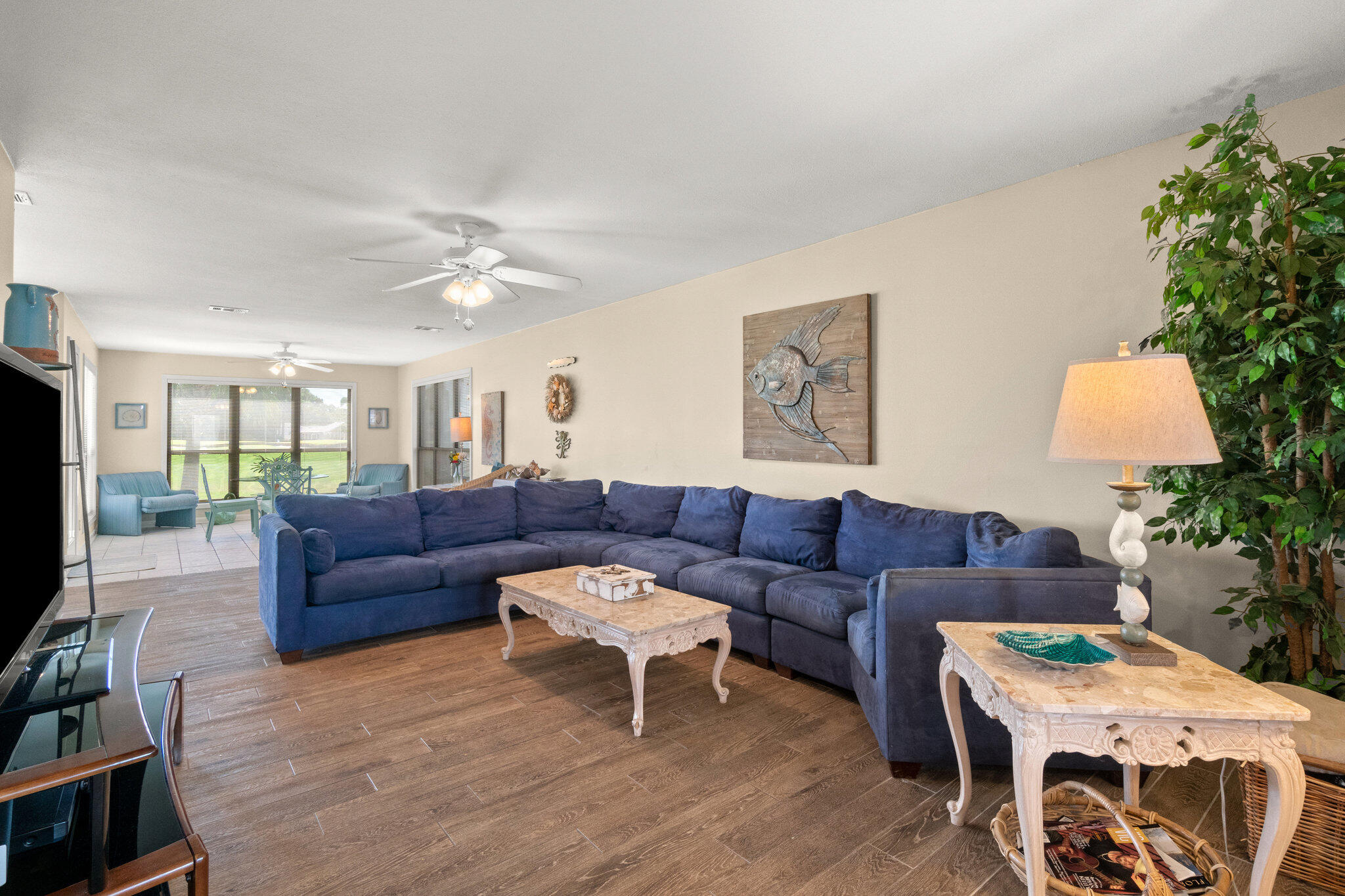 752 Sandpiper Drive, Unit 10535 Miramar Beach, FL 32550 - Photo 5 of 32 a living room with furniture and a potted plant