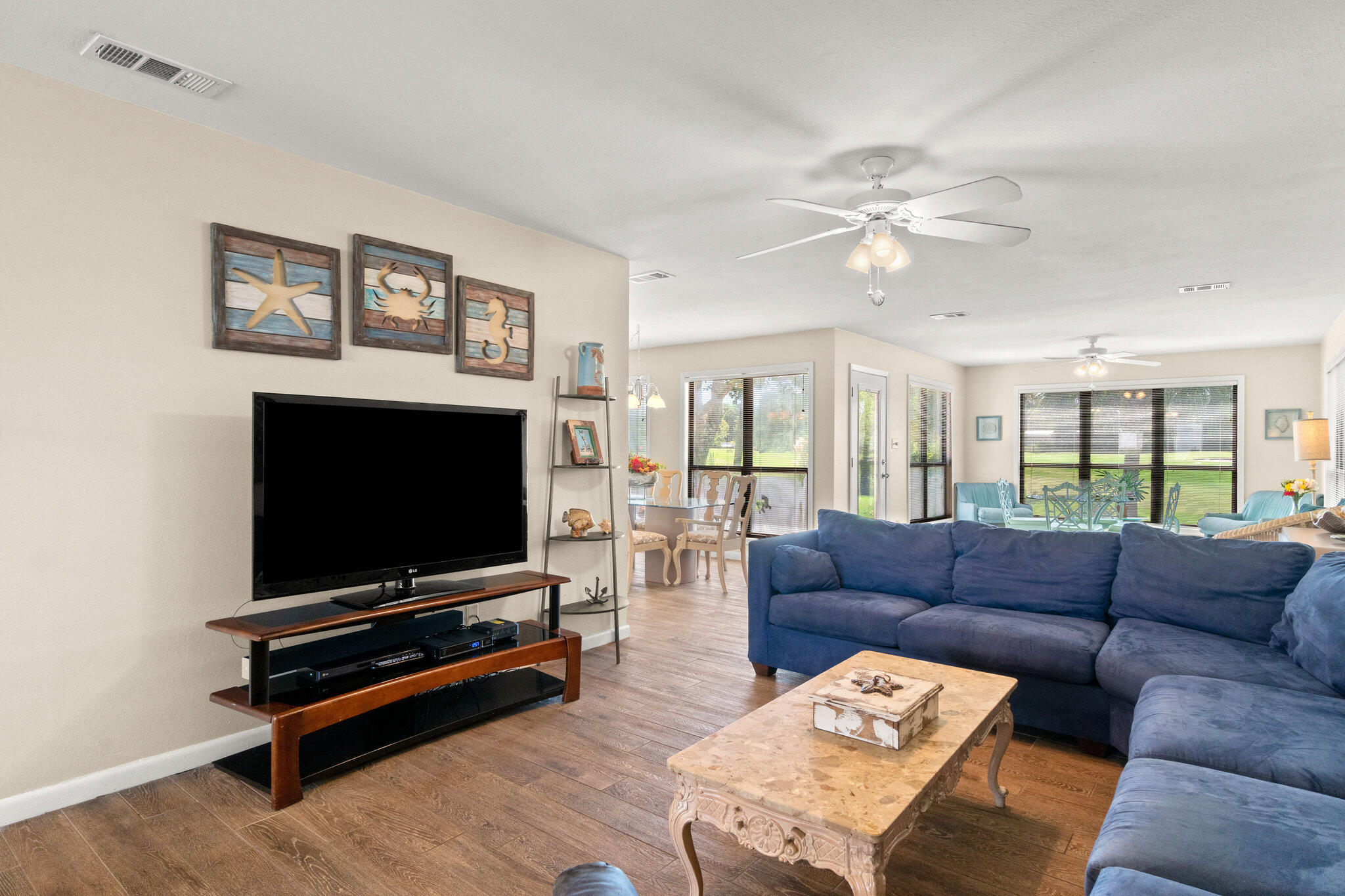 752 Sandpiper Drive, Unit 10535 Miramar Beach, FL 32550 - Photo 6 of 32 a living room with furniture and a flat screen tv