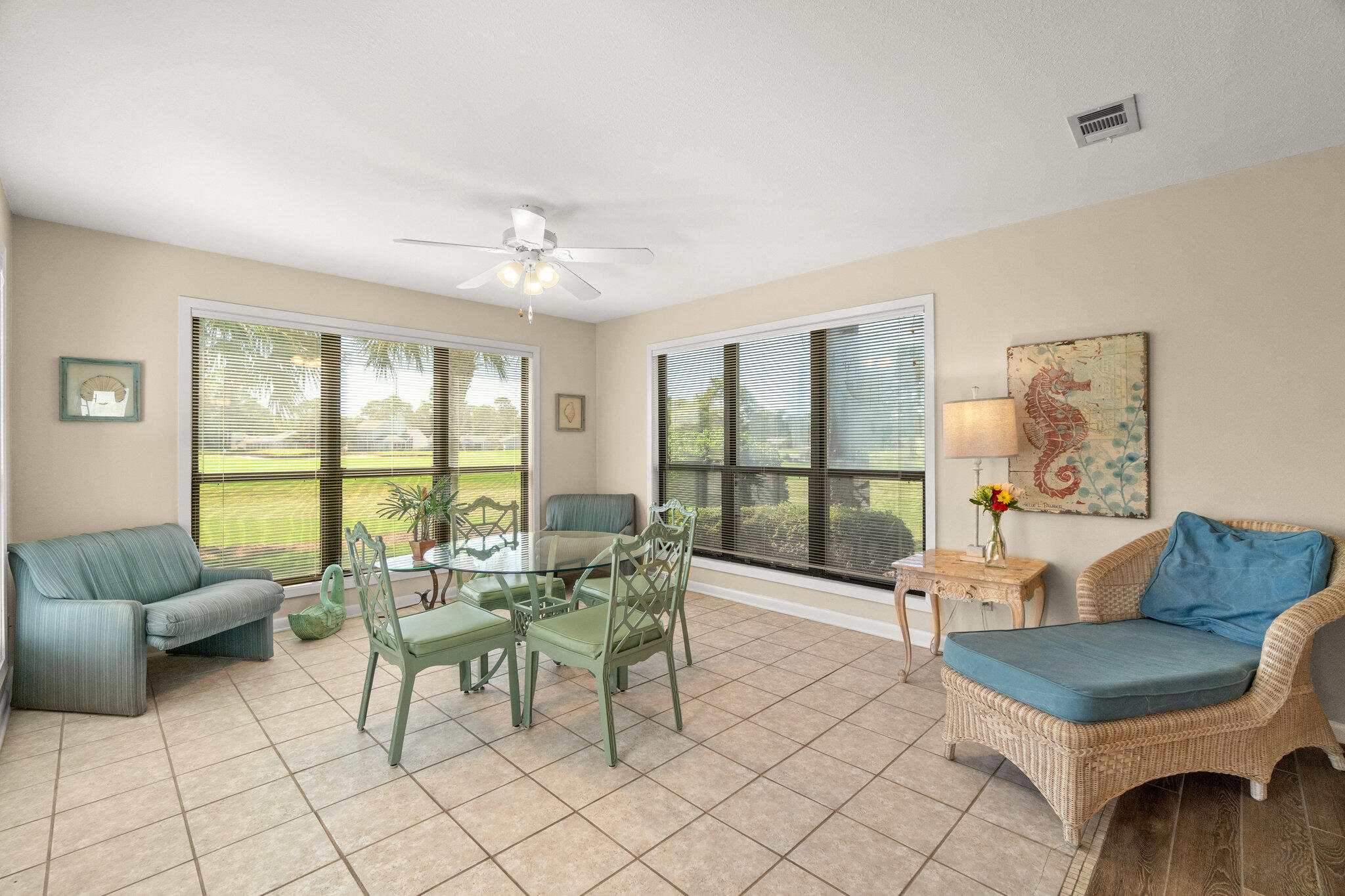 752 Sandpiper Drive, Unit 10535 Miramar Beach, FL 32550 - Photo 10 of 32 a living room with furniture and a floor to ceiling window