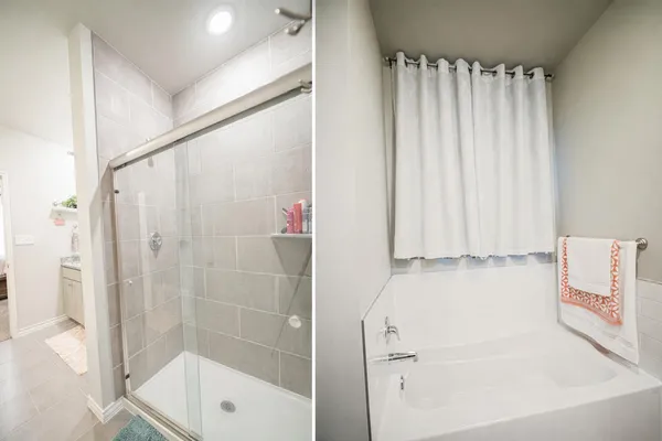 a bathroom with a bathtub and a shower