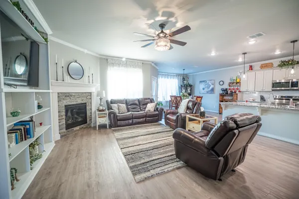 a living room with furniture and a fireplace
