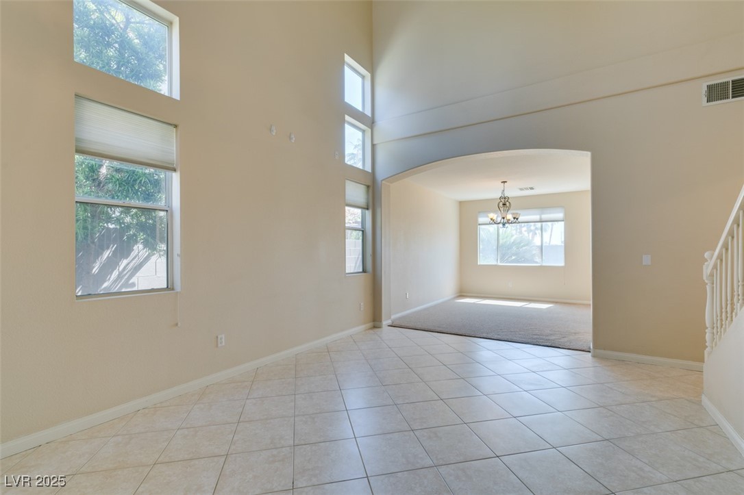 3766 Port Ritchey Street Las Vegas, NV 89147 - Photo 4 of 26 Spare room with a towering ceiling, arched walkway