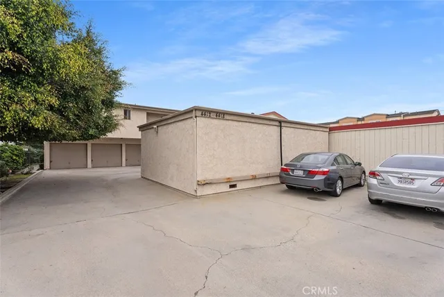 a view of a cars park in front of house