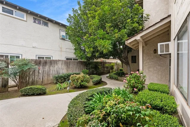 a view of a backyard with potted plants