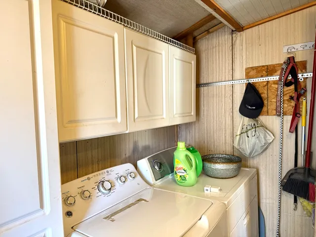 a kitchen with a stove top oven a sink and a window