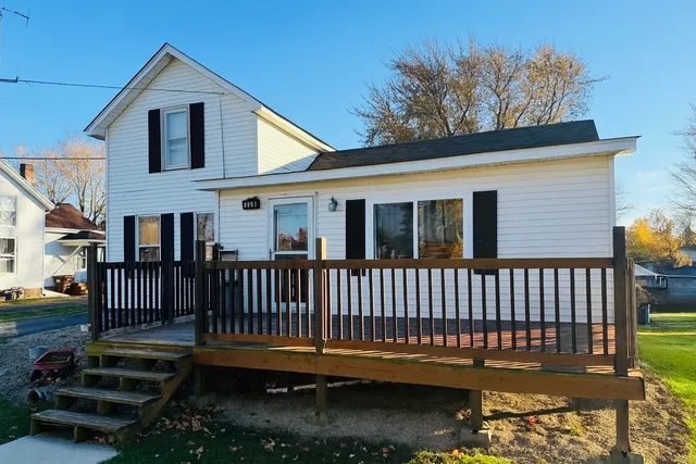 a view of a deck with a yard