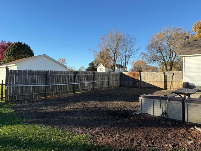 a view of backyard with green space