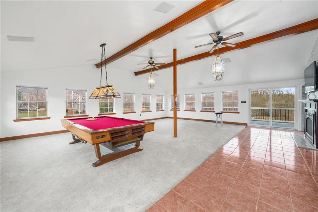 988 Hoch Road Danielsville, PA 18038 - Photo 4 of 29 A spacious recreation room featuring high ceilings, numerous windows, and a dedicated pool table area.