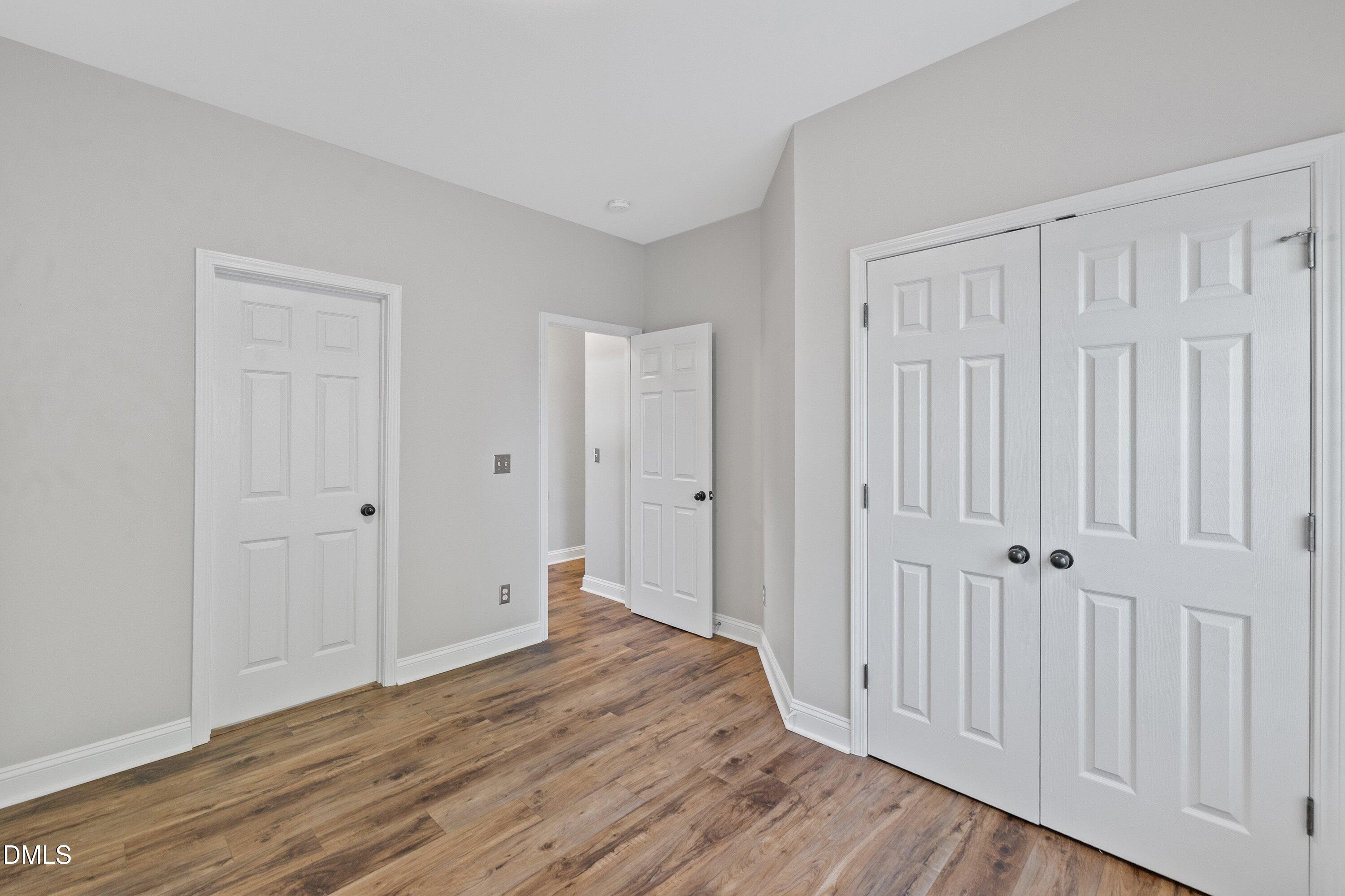 3717 Windmeade Road Wake Forest, NC 27587 - Photo 26 of 51 a view of a hallway with wooden floor