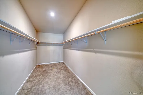 a view of empty room with a fireplace