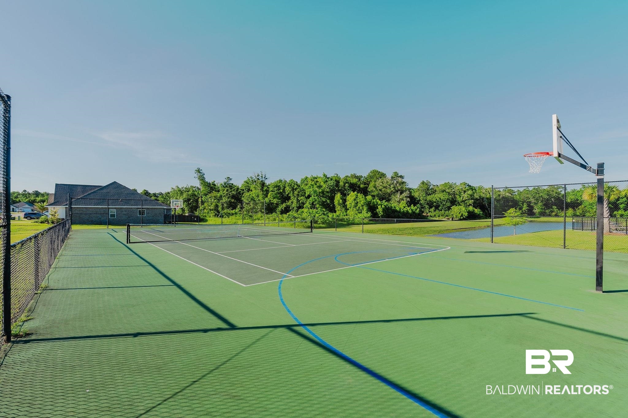 7872 Calverton Street Foley, AL 36535 - Photo 63 of 76 Multi-sport court featuring a tennis court with net and a basketball court with hoop