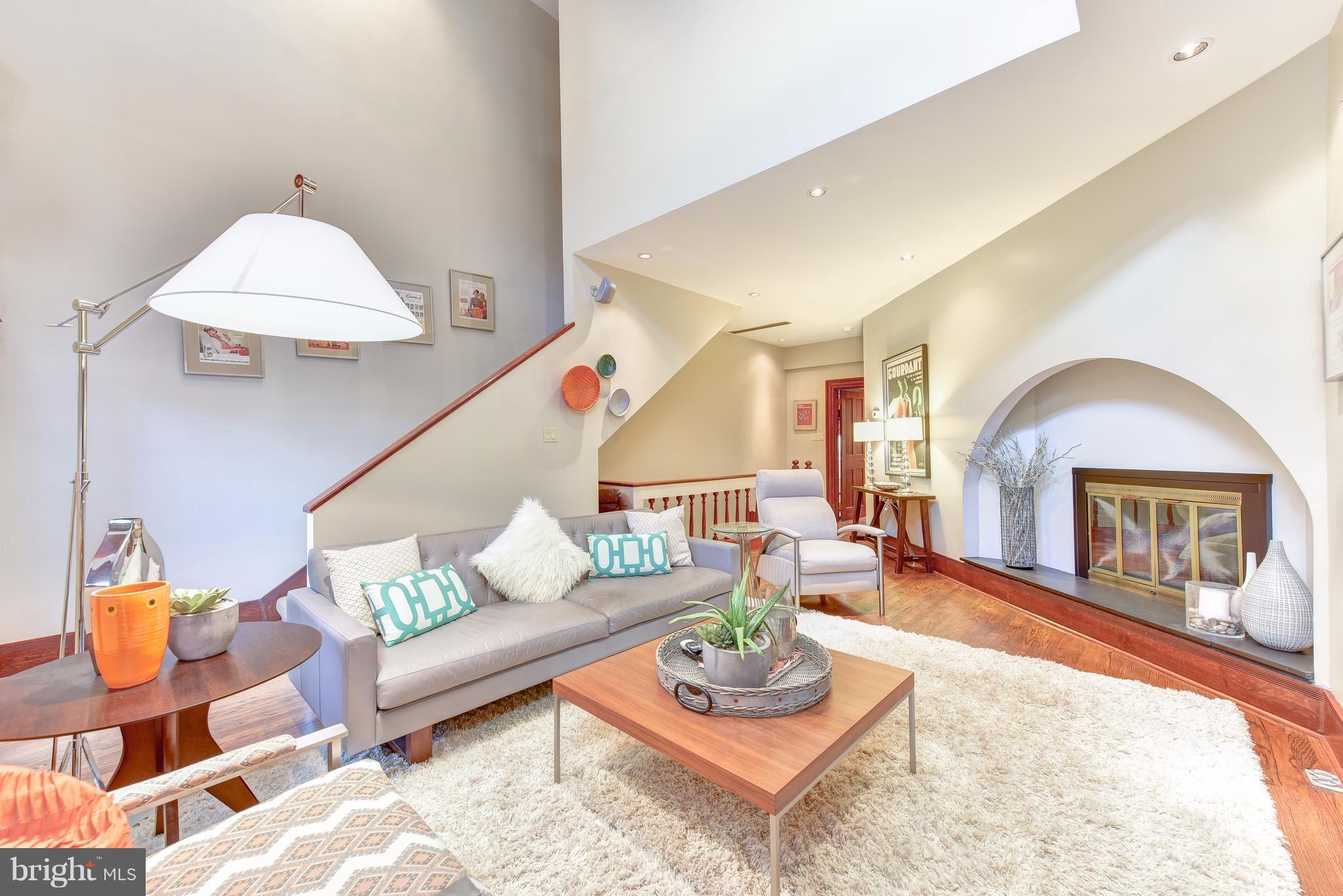 1016 Massachusetts Avenue Northeast Washington, DC 20002 - Photo 16 of 28 a living room with furniture and a fireplace