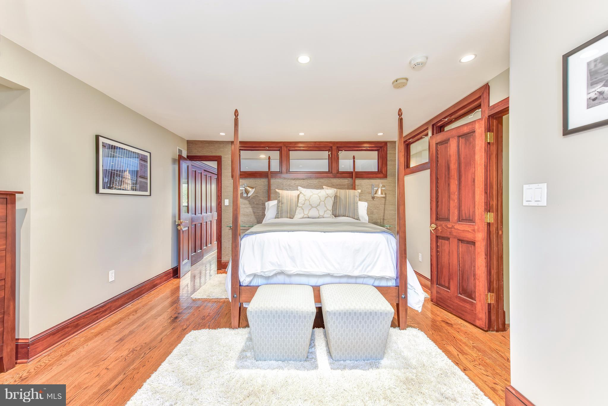 1016 Massachusetts Avenue Northeast Washington, DC 20002 - Photo 19 of 28 a bedroom with a large bed and a large window