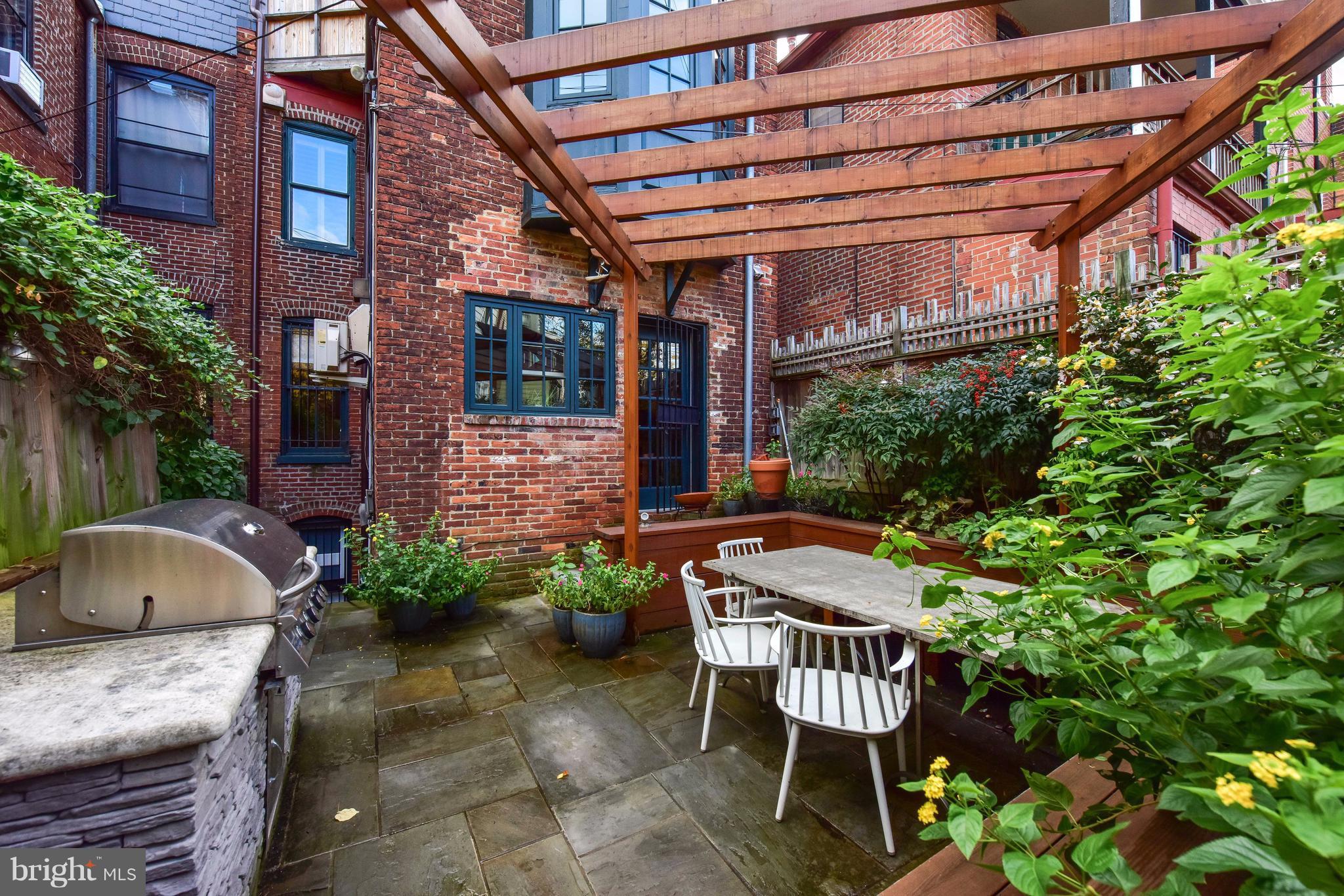1016 Massachusetts Avenue Northeast Washington, DC 20002 - Photo 28 of 28 a chairs and table in front of a building